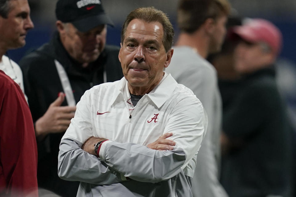 Alabama head coach Nick Saban runs onto the field before the Southeastern Conference championship NCAA college football game against Georgia in Atlanta, Saturday, Dec. 2, 2023. (AP Photo/Mike Stewart)