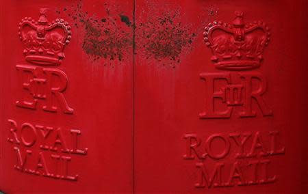 Paint peels on Royal Mail post boxes outside a sorting office in Altrincham, northern England September 12, 2013. REUTERS/Phil Noble