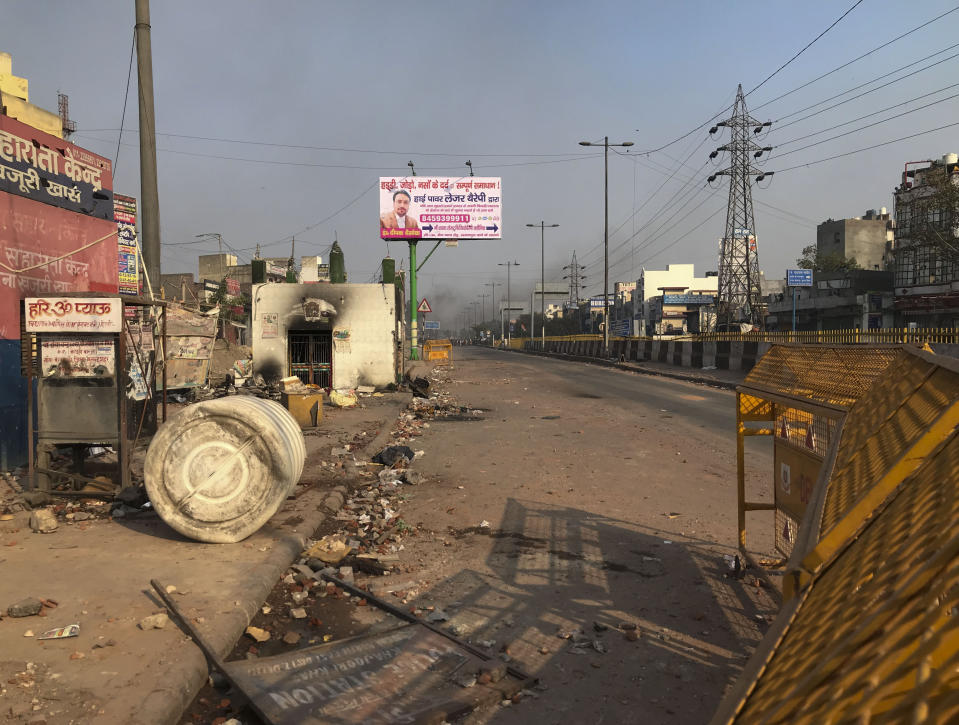 A water tank vandalized by a mob lies on a pavement following violence between two groups in New Delhi, India, Tuesday, Feb. 25, 2020. An angry group of Hindus carrying pickaxes and iron rods hurled rocks at Muslims in new violence in the Indian capital over a new citizenship law on Tuesday, with at least 10 people killed in two days of clashes that cast a shadow over U.S. President Donald Trump's visit to the country. (AP Photo/Rishabh. R. Jain)