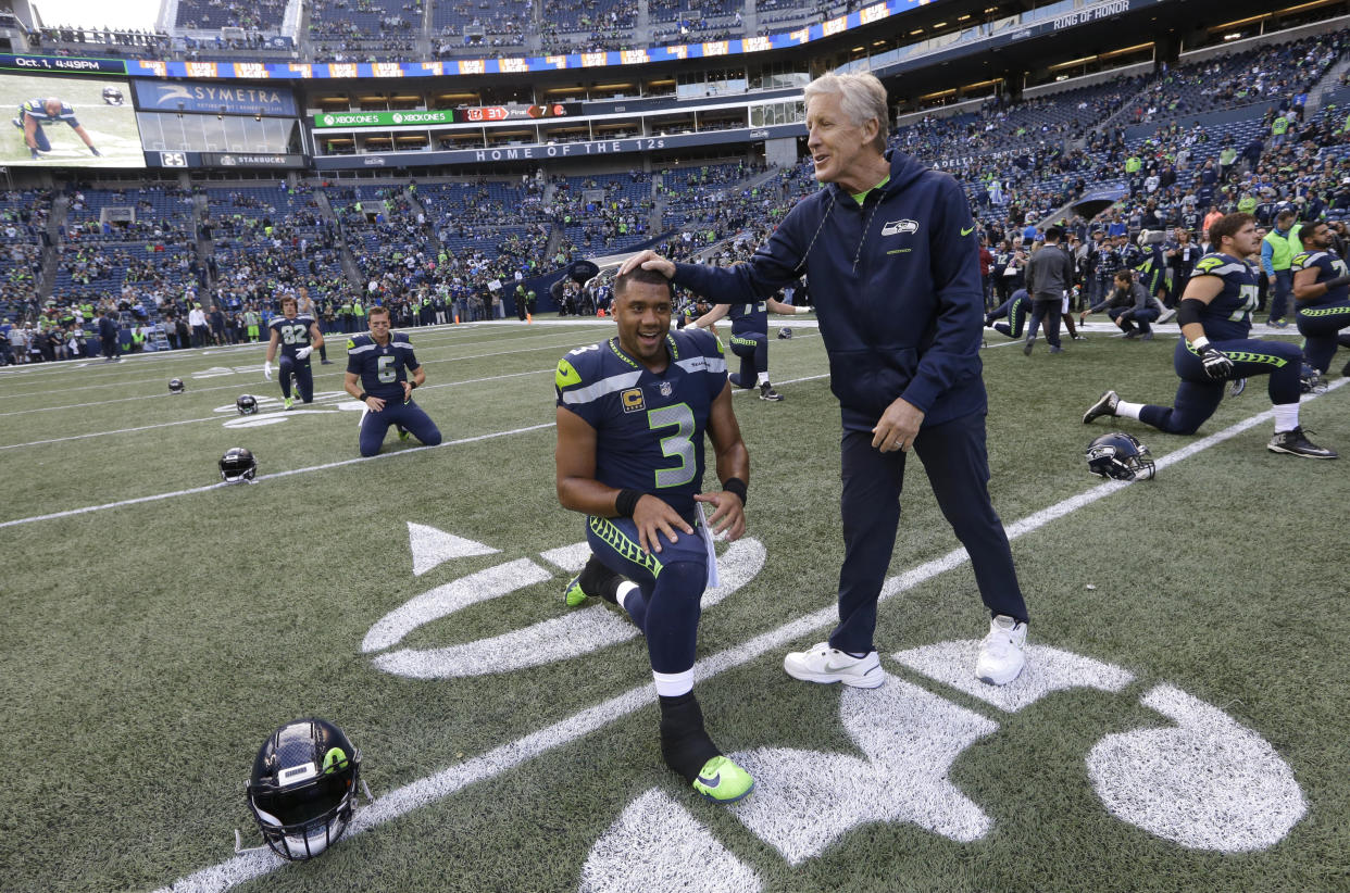 Seahawks quarterback Russell Wilson dressed as his head coach, Pete Carroll, for Halloween. (AP)