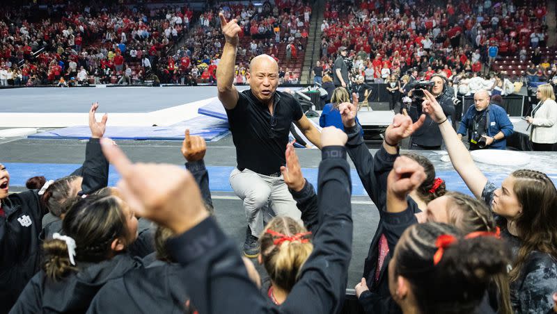 Utah’s head coach Tom Farden leads the team in a chant after winning the Pac-12 Gymnastics Championships at the Maverik Center in West Valley City on March 18, 2023.