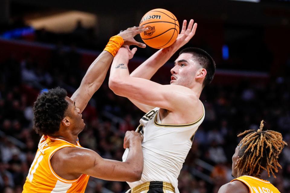Purdue center Zach Edey (15) makes a jump shot against Tennessee forward Tobe Awaka (11) during the first half of the NCAA tournament Midwest Regional Elite 8 round at Little Caesars Arena in Detroit on Sunday, March 31, 2024.