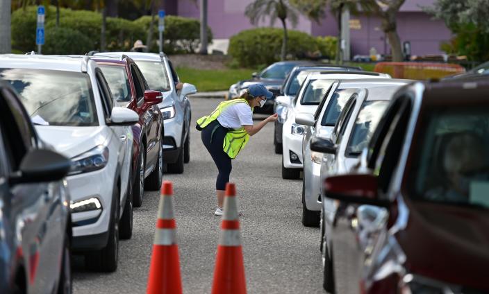 The city of Sarasota hosted a drive-thru COVID-19 vaccination clinic early last year in the parking lot of the Van Wezel Performing Arts Hall.