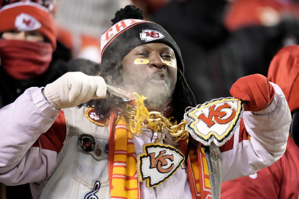 A Kansas City Chiefs fan cheers before an NFL wild-card playoff football game between the Chiefs and the Miami Dolphins on Saturday, Jan. 13, 2024, in Kansas City, Mo. (AP Photo/Charlie Riedel)
