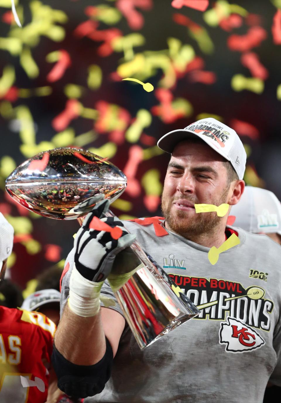 Feb 2, 2020; Miami Gardens, Florida, USA; Kansas City Chiefs tackle Eric Fisher (72) celebrates with the Vince Lombardi Trophy after defeating the San Francisco 49ers in Super Bowl LIV at Hard Rock Stadium. Mandatory Credit: Mark J. Rebilas-USA TODAY Sports