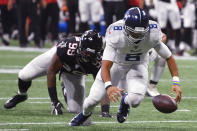 Tennessee Titans quarterback Marcus Mariota (8) works to recover his fumble against the Atlanta Falcons during the second half of an NFL football game, Sunday, Sept. 29, 2019, in Atlanta. (AP Photo/John Amis)