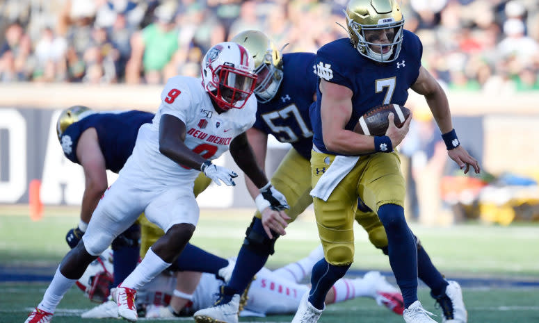 Notre Dame quarterback Brendon Clark runs vs. New Mexico.