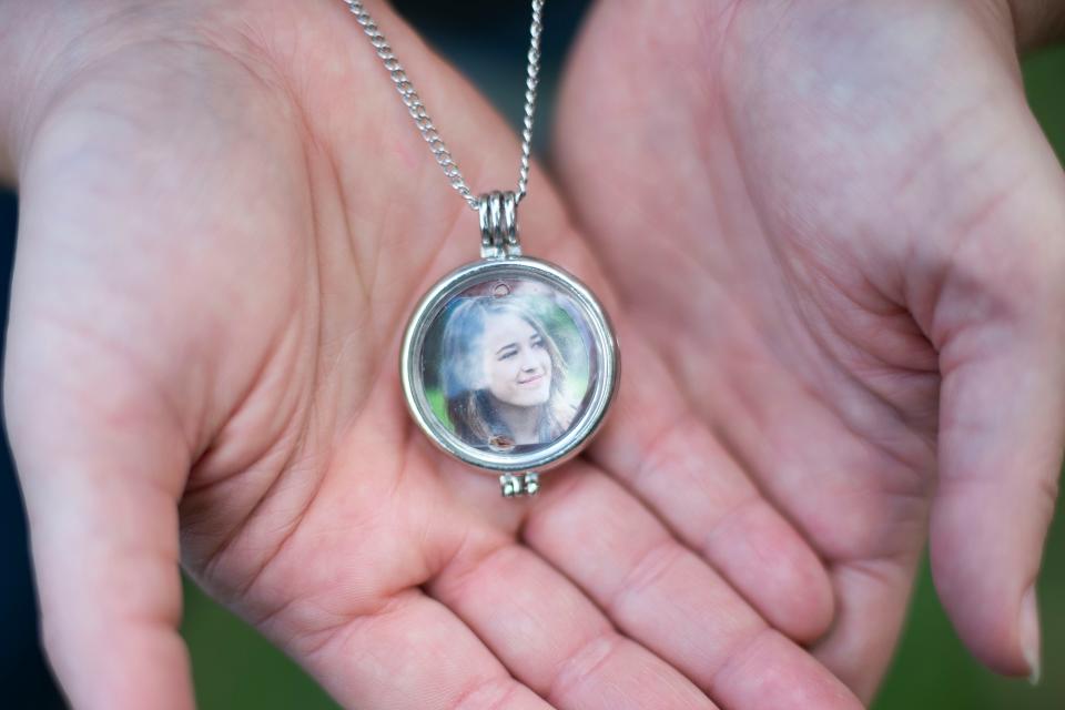 Melissa Eimers wears a locket of her daughter Hannah Eimers' senior portrait from 2015 around her neck.