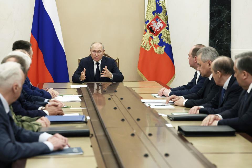 Russian President Vladimir Putin chairs a meeting with the heads of Russian law enforcement agencies at the Kremlin in Moscow, Russia, on Monday.