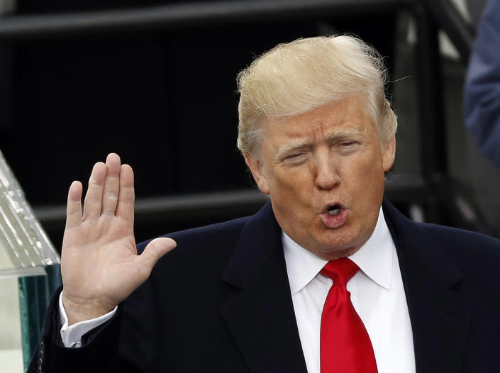 <p>US President Donald Trump takes the oath of office during his inauguration at the U.S. Capitol in Washington on Jan. 20, 2017. (Photo: Kevin Lamarque/Reuters) </p>