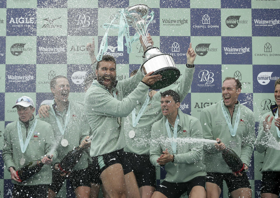 Cambridge celebrate winning the Men's Boat Race on the River Thames, London, Sunday, April 7, 2019. (Adam Davy/PA via AP)