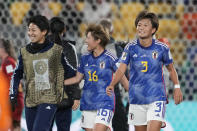 Japan's players celebrate at the end of the Women's World Cup Group C soccer match between Japan and Spain in Wellington, New Zealand, Monday, July 31, 2023. (AP Photo/John Cowpland)
