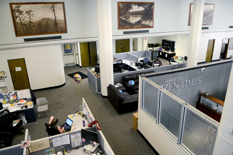 The Asheville Citizen Times newsroom in 2018, when it used to occupy the building's first floor, where Citizen Vinyl and Sessions Bar are now located.