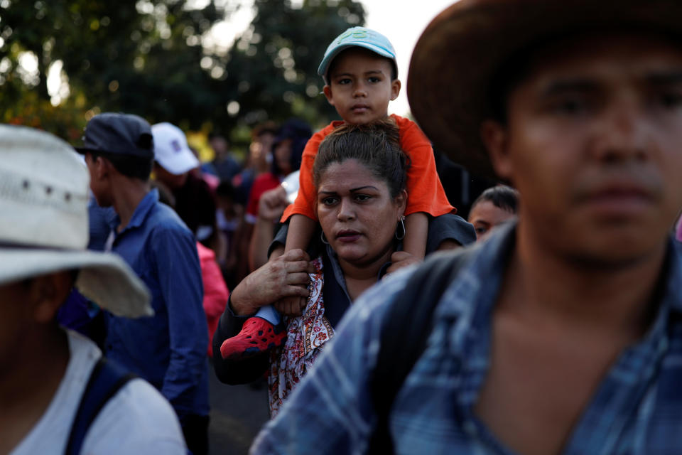 Central American migrants, part of a caravan trying to reach the U.S., walk along the road in Ciudad Hidalgo, Mexico. (Photo: Carlos Garcia Rawlins/Reuters)