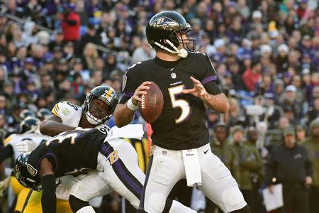 Nov 4, 2018; Baltimore, MD, USA; Baltimore Ravens quarterback Joe Flacco (5) throws as running back Javorius Allen (37) blocks Pittsburgh Steelers cornerback Mike Hilton (28) during the third quarter at M&T Bank Stadium. Mandatory Credit: Tommy Gilligan-USA TODAY Sports