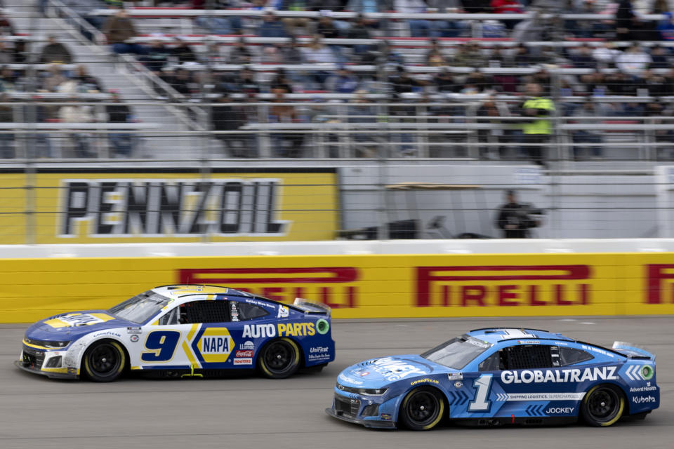 Ross Chastain (1) begins to pass Josh Berry (9) during a NASCAR Cup Series auto race on Sunday, March 5, 2023, in Las Vegas. (AP Photo/Ellen Schmidt)