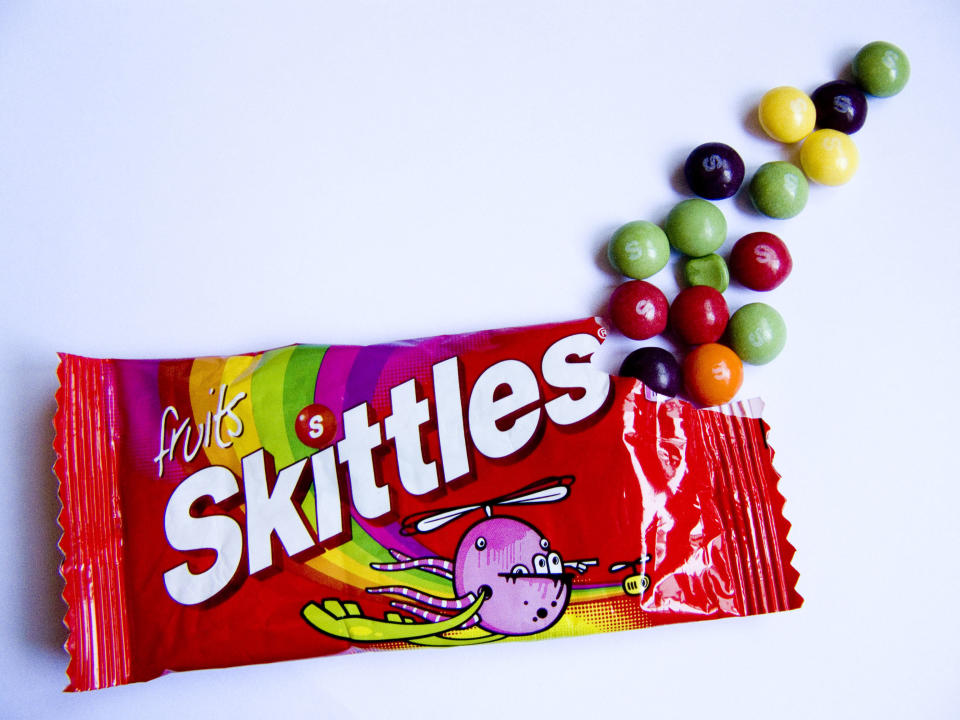 Don't let the "apple juice from concentrate" fool you into thinking that the <a href="http://www.wrigley.com/global/brands/skittles.aspx#panel-3">19 ingredients in Skittles</a> have some health value -- it's just a <a href="http://www.huffingtonpost.com/2012/09/13/other-names-for-sugar-maltose-dextrose_n_1874487.html">sneaky way to say "sugar."</a> Sugar, corn syrup, hydrogenated palm kernel oil, apple juice from concentrate, citric acid, dextrin, modified corn starch, natural and artificial flavors, yellow 6 lake, red 40 lake, yellow 5 lake, blue 2 lake, yellow 5, red 40, yellow 6, blue 1 lake, blue 1, ascorbic acid