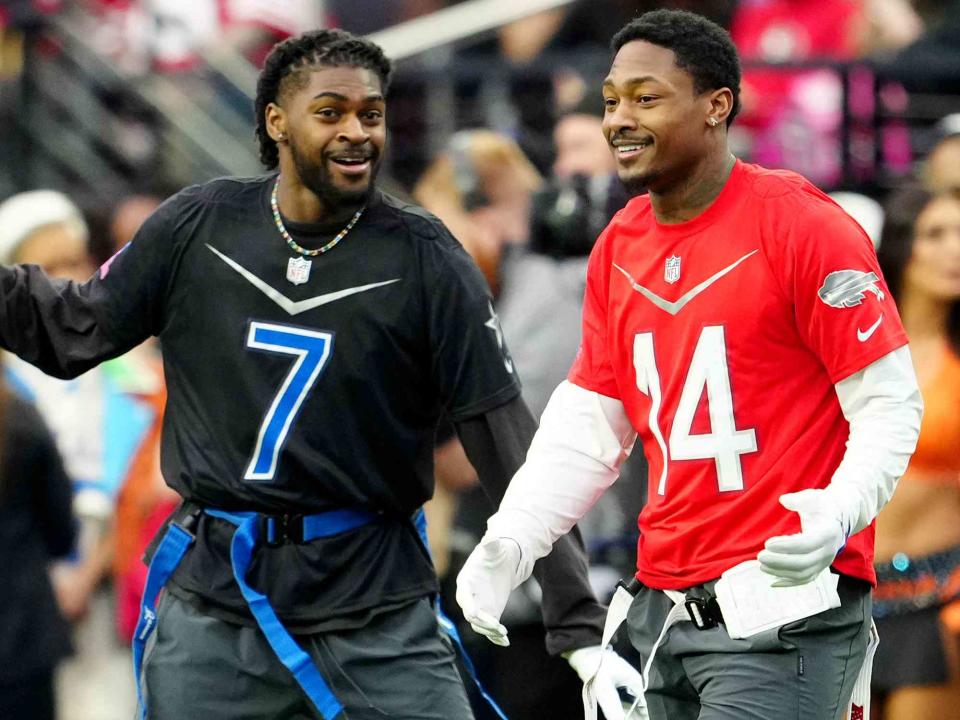 <p>Jeff Bottari/Getty</p> Trevon Diggs and Stefon Diggs during the 2023 NFL Pro Bowl Games at Allegiant Stadium on February 05, 2023.