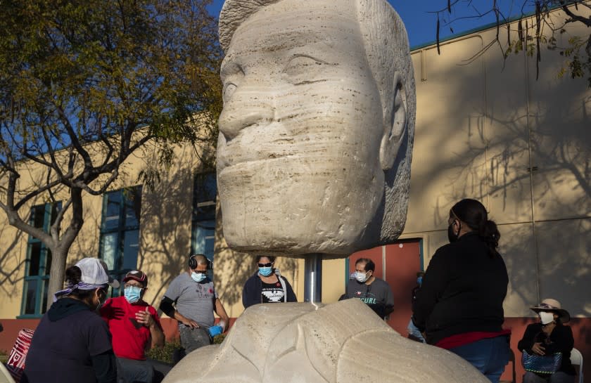 OXNARD, CA - FEBRUARY 10: Members of the United Farm Workers hold an organizing event near a sculpture of Cesar Chavez on Wednesday, Feb. 10, 2021 in Oxnard, CA. (Brian van der Brug / Los Angeles Times)