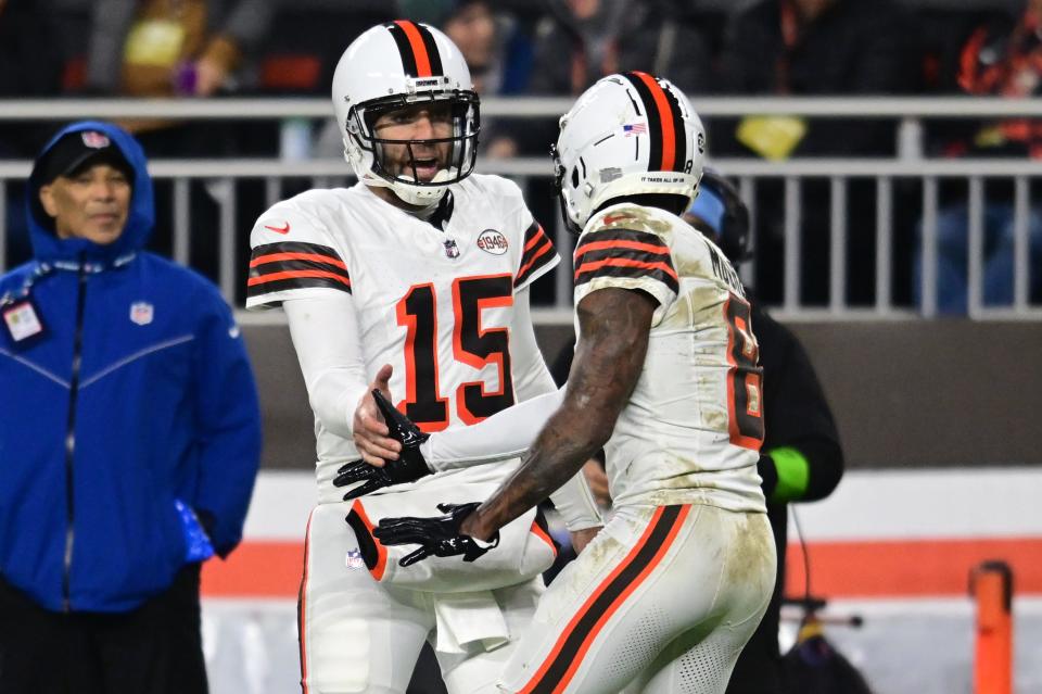 Cleveland Browns quarterback Joe Flacco (15) and wide receiver Elijah Moore (8) celebrate after a touchdown against the New York Jets on Dec. 28, 2023, in Cleveland.