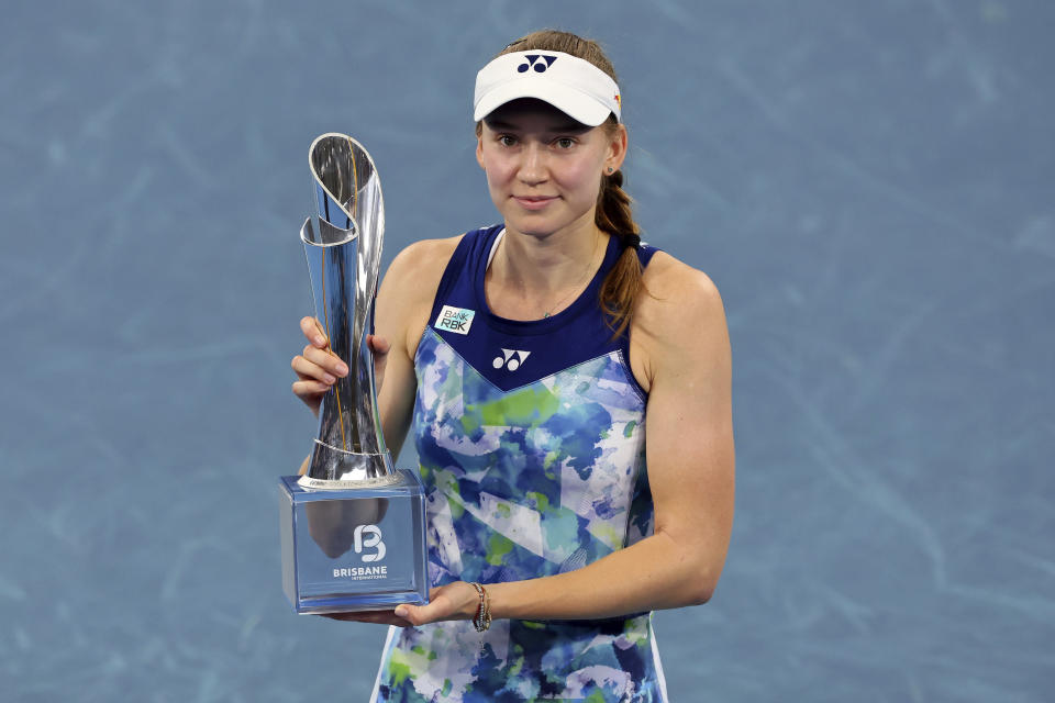 Elena Rybakina of Kazakhstan poses with the trophy after she won her final match against Aryna Sabalenka of Belarus during the Brisbane International tennis tournament in Brisbane, Australia, Sunday, Jan. 7, 2024. (AP Photo/Tertius Pickard)