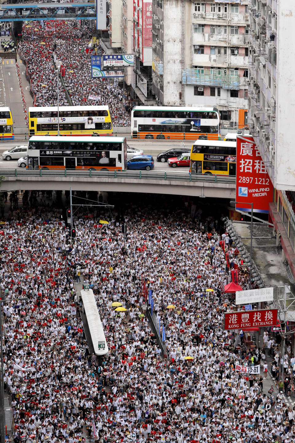 Thousands of protesters march in a rally against the proposed amendments to extradition law in Hong Kong, Sunday, June 9, 2019. Source: AP