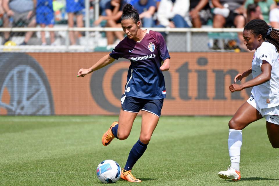 North Carolina Courage defender Carson Pickett (4) kicks the ball against the San Diego Wave FC in National Women's Soccer League action during the second half at WakeMed Soccer Park on May 22, 2022. Mandatory Credit: Rob Kinnan/USA TODAY Sports
