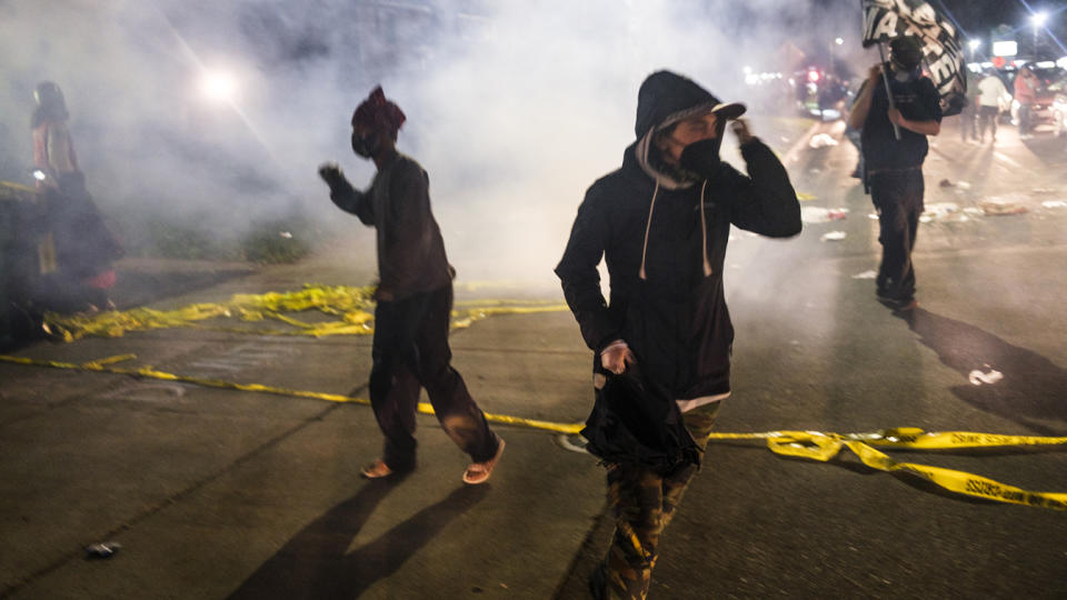 Tear gas fills the air outside the Brooklyn Center Police Station during protests over the fatal police shooting of a Black man during a traffic stop in the Mineapolis suburb on Sunday. (Photo by Stephen Maturen/Getty Images)