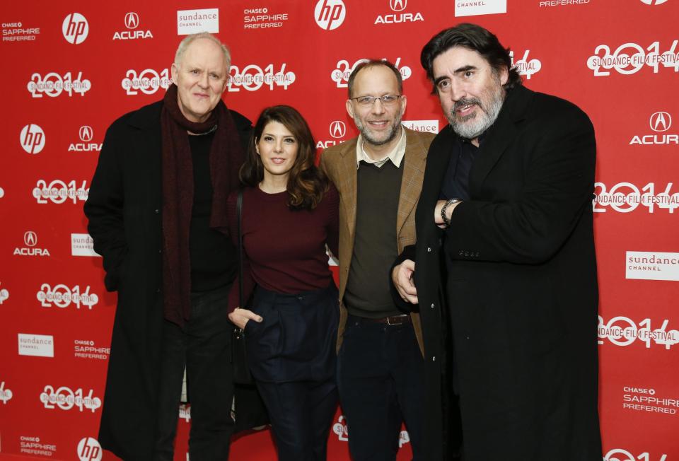 File-This Jan. 18, 2014, file photo shows Writer and director Ira Sachs, second right, poses with cast members from left to right, John Lithgow, Marisa Tomei, and Alfred Molina at the premiere of the film "Love is Strange" during the 2014 Sundance Film Festival, in Park City, Utah. (Photo by Danny Moloshok/Invision/AP)