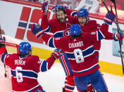 Montreal Canadiens left wing Artturi Lehkonen (62) celebrates with teammates after scoring the winning goal against the Vegas Golden Knights during overtime in Game 6 of an NHL hockey Stanley Cup semifinal playoff series Thursday, June 24, 2021 in Montreal. (Ryan Remiorz/The Canadian Press via AP)