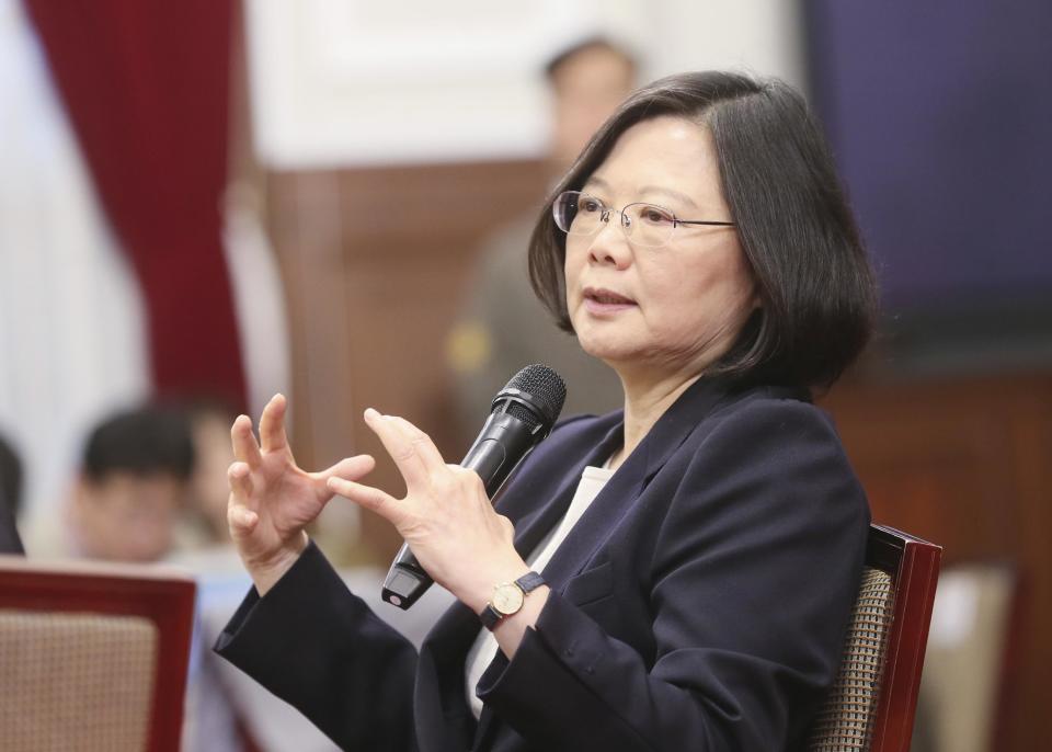 In this photo released by the Taiwan Presidential Office, President Tsai Ing-wen delivers a year-end speech during an international press conference at the presidential office, Saturday, Dec. 31, 2016, in Taipei, Taiwan. President Tsai urged China to engage in "calm and rational" dialogue to maintain peace, vowing not to give in to Beijing's recent moves to "threaten and intimidate" the self-ruled island. (Taiwan Presidential Office via AP)