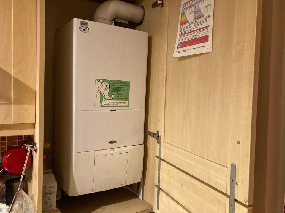 A boiler in a cabinet.