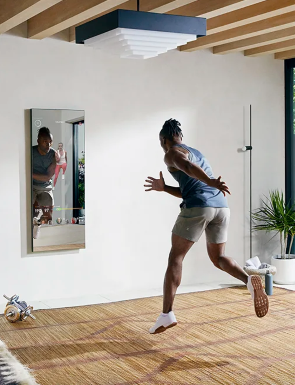 man working out in front of The Mirror 