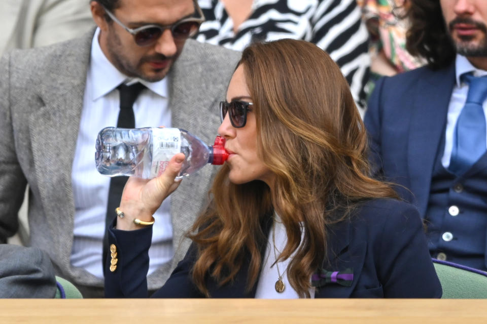 LONDON, ENGLAND - JULY 02: Catherine, Duchess of Cambridge takes a drink from a water bottle during the Wimbledon Championships Tennis Tournament at All England Lawn Tennis and Croquet Club on July 02, 2021 in London, England. (Photo by Karwai Tang/WireImage)