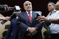 Former Mayor of New York Rudy Giuliani speaks to reporters as he leaves his apartment building in New York, Wednesday, Aug. 23, 2023. (AP Photo/Seth Wenig)