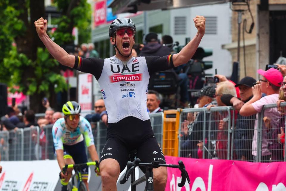 UAE Team Emiratess German rider Pascal Ackermann celebrates after he crossed the finish line to win the eleventh stage of the Giro dItalia 2023 cycling race 219 km between Camaiore and Tortona on May 17 2023 Photo by Luca Bettini  AFP Photo by LUCA BETTINIAFP via Getty Images