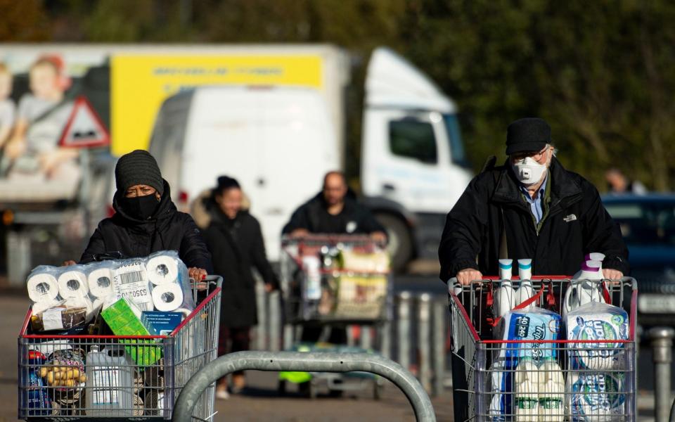 Shoppers at a Costco store in Birmingham, ahead of a national lockdown for England from Thursday. - Jacob King /PA