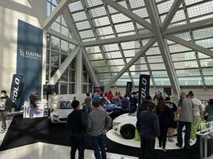 Consumers and industry participants evaluate the SOLO EV at the Los Angeles Auto Show