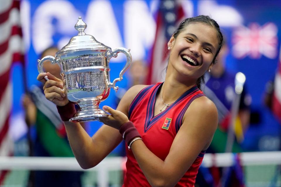 A delighted Emma Raducanu holds up the US Open trophy (Seth Wenig/AP) (AP)