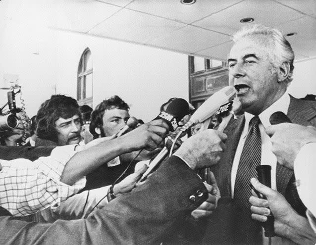 Whitlam addresses reporters outside the Parliament building in Canberra after his dismissal. Source: Getty Images
