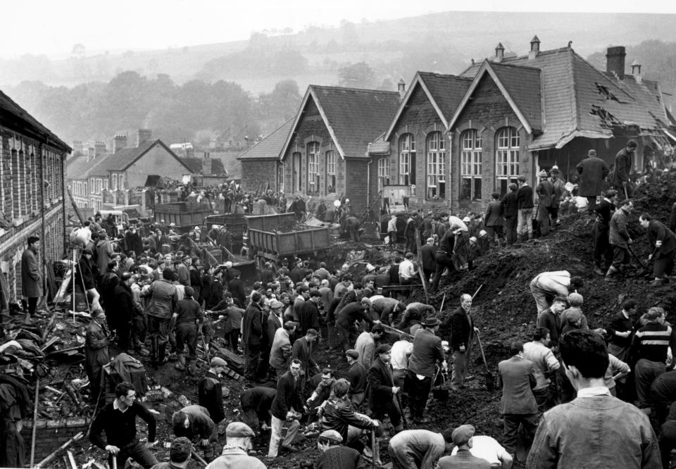 Rescue workers search for victims of the Aberfan disaster, in South Wales, 1966.