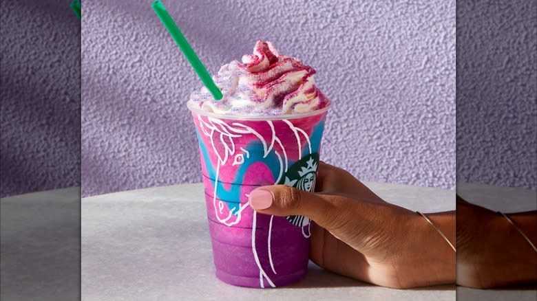 hand holding Unicorn Frappuccino