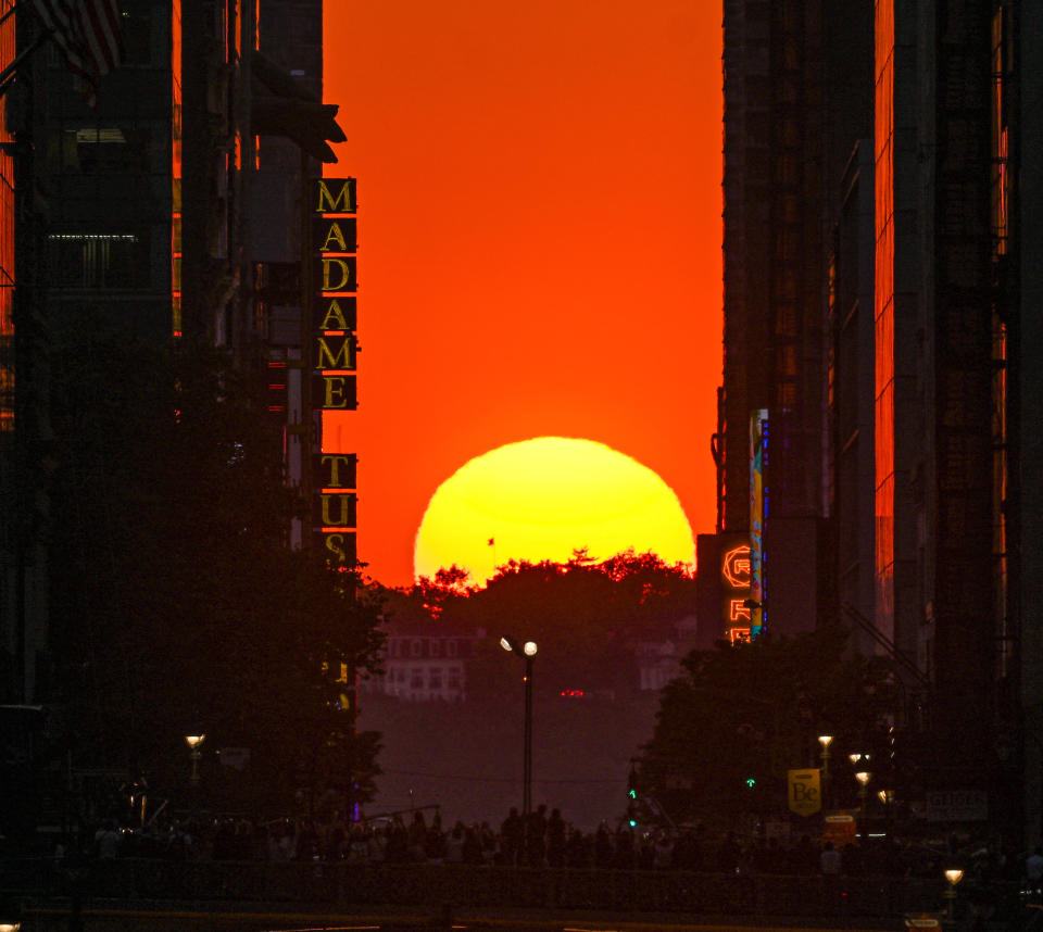 A view of the sunset from 42nd street during the 'Manhattanhenge' on May 29, 2023 in New York, United States.