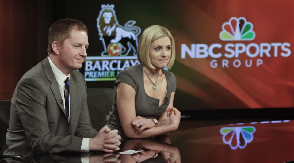 FILE - In this April 16, 2013, file photo, Arlo White, left, and Rebecca Lowe listen during a joint NBC and English Premier League (EPL) press conference in New York. Arlo White is used to the ebbs and flows of a Premier League season, but the past couple weeks have been a rollercoaster. White will call Saturday's, May 8, 2021, Manchester City-Chelsea match on NBC as City looks to clinch its third league title in four seasons. This comes less than a week after White was across town at Old Trafford and had to describe fans storming the field, which led to the cancellation of Manchester United's match against Liverpool. (AP Photo/Bebeto Matthews, File)