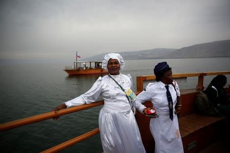 Christian tourists from Nigeria stand during a boat ride in the Sea of Galilee, northern Israel November 30, 2016. REUTERS/Ronen Zvulun/File Photo