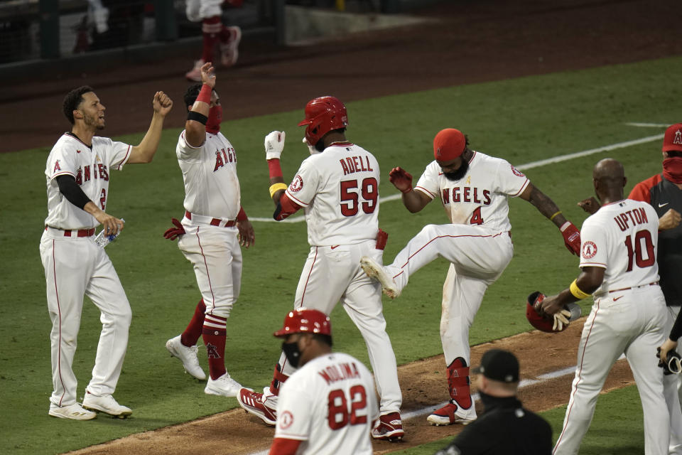 The Los Angeles Angels celebrate near home plate. 