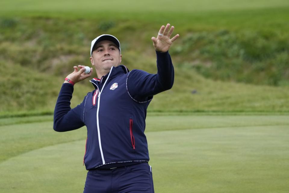 Team USA's Justin Thomas throws a ball to the crowd at the ninth hole during a practice day at the Ryder Cup at the Whistling Straits Golf Course Thursday, Sept. 23, 2021, in Sheboygan, Wis. (AP Photo/Ashley Landis)