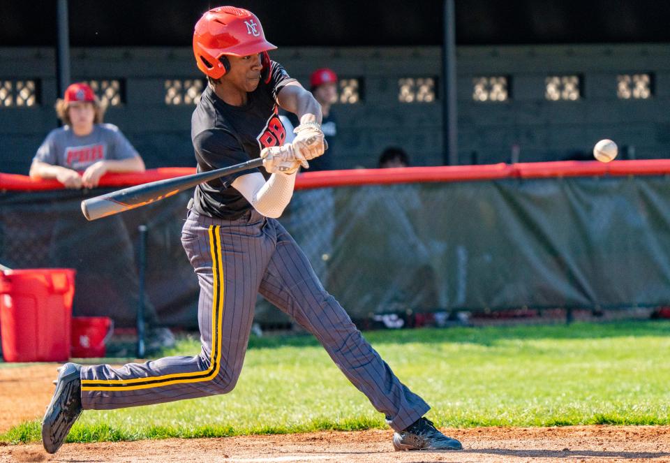 North Central High School junior Micah Rienstra-Kiracofe swings at a pitch Thursday, May 4, 2023, during practice at North Central High School in Indianapolis.