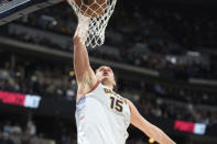 Denver Nuggets center Nikola Jokic dunks against the Minnesota Timberwolves during the second half of Game 5 of an NBA basketball first-round playoff series Tuesday, April 25, 2023, in Denver. (AP Photo/David Zalubowski)