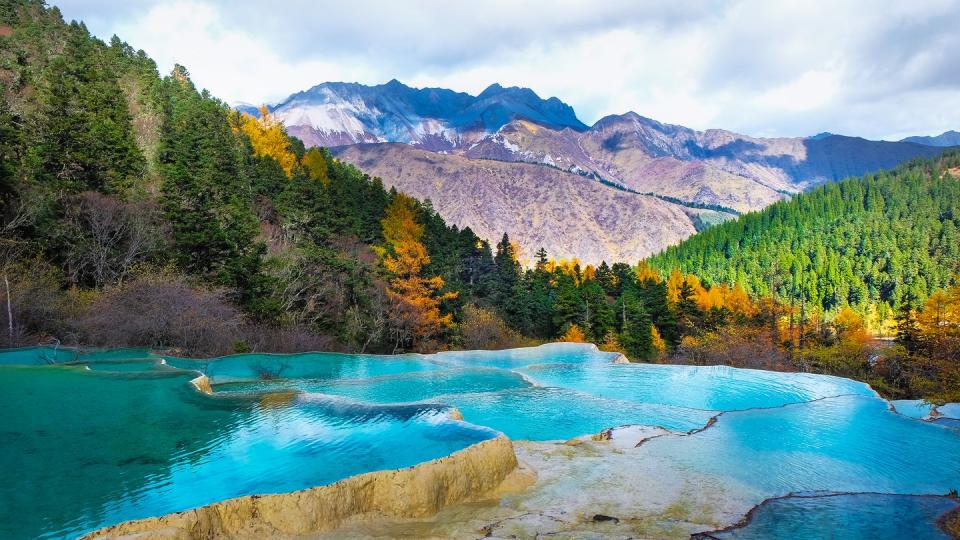 <p>Inside the Jiuzhaigou National Park in the Sichuan Province of China, you'll find crystal clear turquoise lakes and hot springs, making the colorful fall foliage even more vibrant. It's the perfect travel destination for nature lovers.</p><p><a class="link " href="https://go.redirectingat.com?id=74968X1596630&url=https%3A%2F%2Fwww.tripadvisor.com%2FHotel_Review-g303770-d312447-Reviews-Sheraton_Jiuzhaigou_Resort-Jiuzhaigou_County_Sichuan.html&sref=https%3A%2F%2Fwww.womenshealthmag.com%2Flife%2Fg41359461%2Fbest-fall-foliage-places%2F" rel="nofollow noopener" target="_blank" data-ylk="slk:BOOK NOW;elm:context_link;itc:0;sec:content-canvas">BOOK NOW</a> <strong><em>Sheraton Jiuzhaigou Resort</em></strong></p>